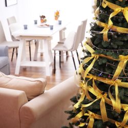 Beautiful decorated Christmas tree in living room, close up view